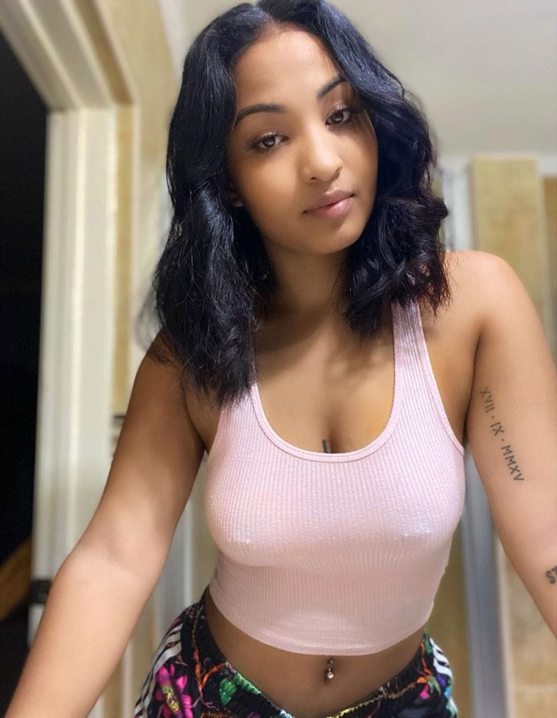 Shenseea Shows Off Her New Nipple Piercings In White Tank Top