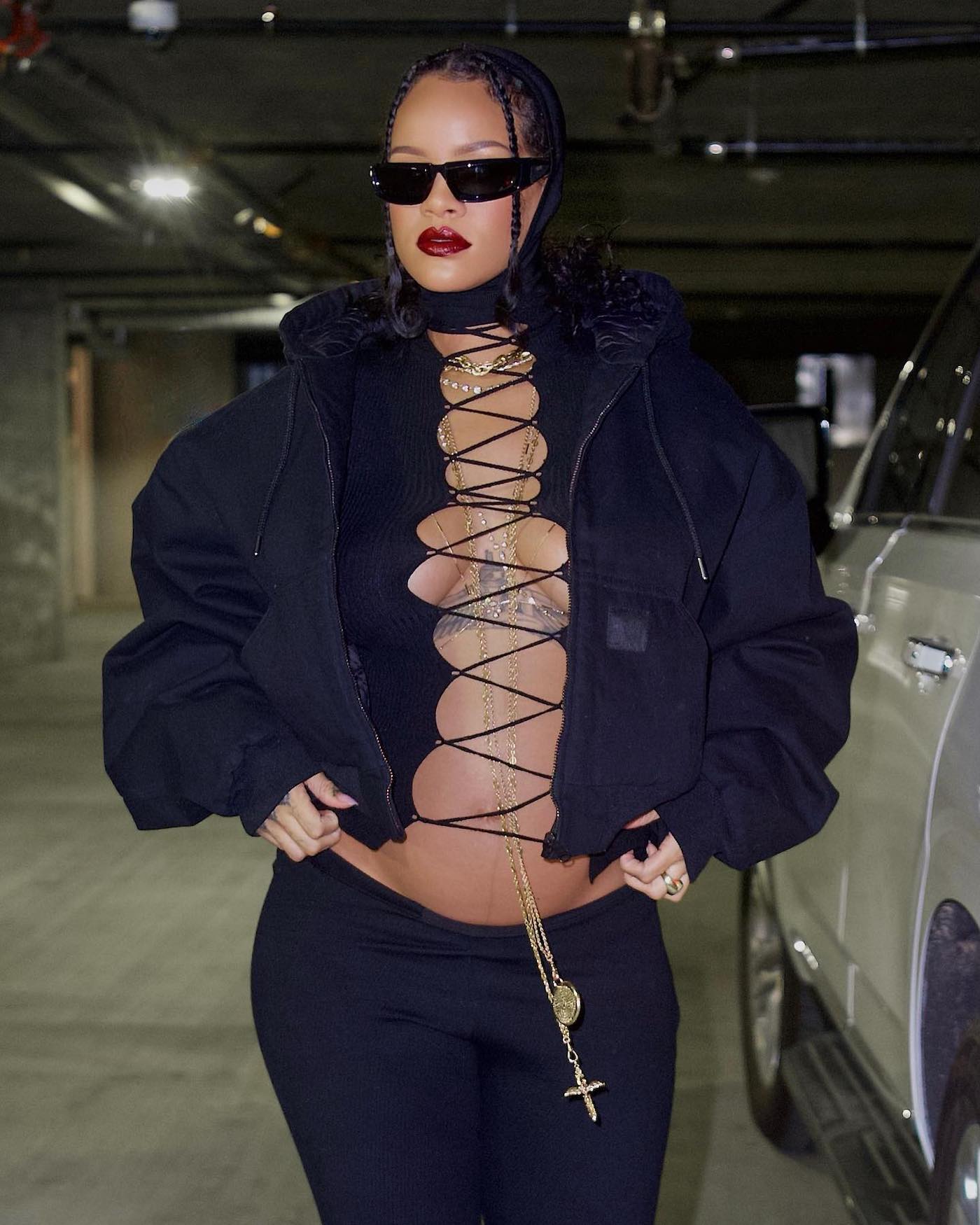 Pregnant Rihanna Shows Off Her Baby Bump In Lace-Up Top Outfit 1